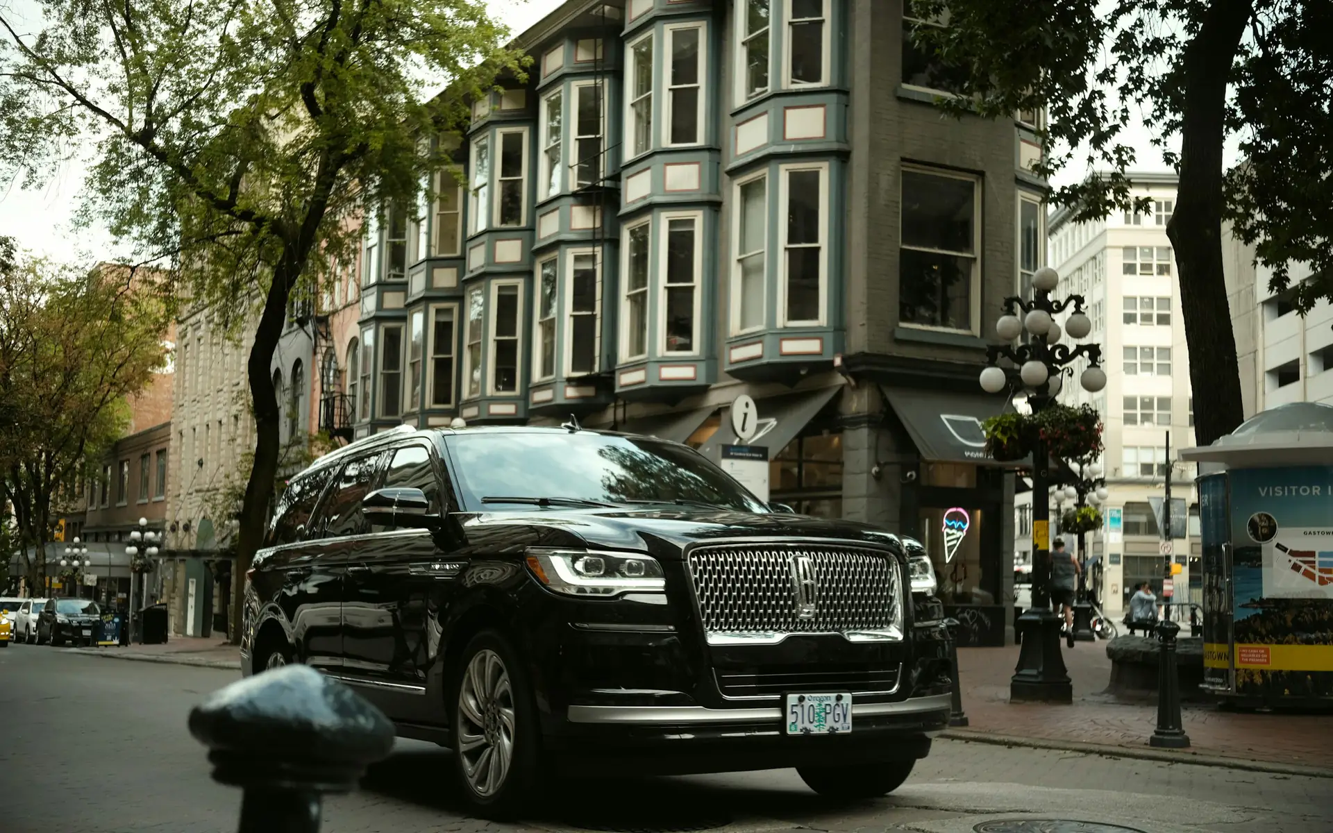 Black Lincoln Navigator luxury SUV limo on a city street